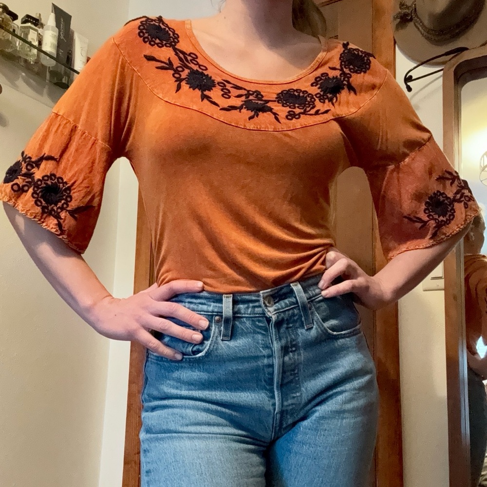 Orange tunic with navy floral embroidery and bell sleeve